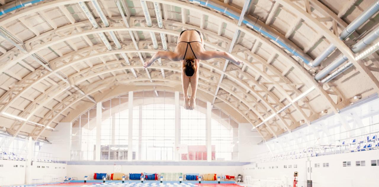 Diver in flight inside indoor facility